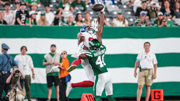 Aug 24, 2024; East Rutherford, New Jersey, USA; New York Jets cornerback Shemar Bartholomew (40) breaks up a pass intended for New York Giants wide receiver Miles Boykin (81) during the second half at MetLife Stadium. Mandatory Credit: Vincent Carchietta-USA TODAY Sports