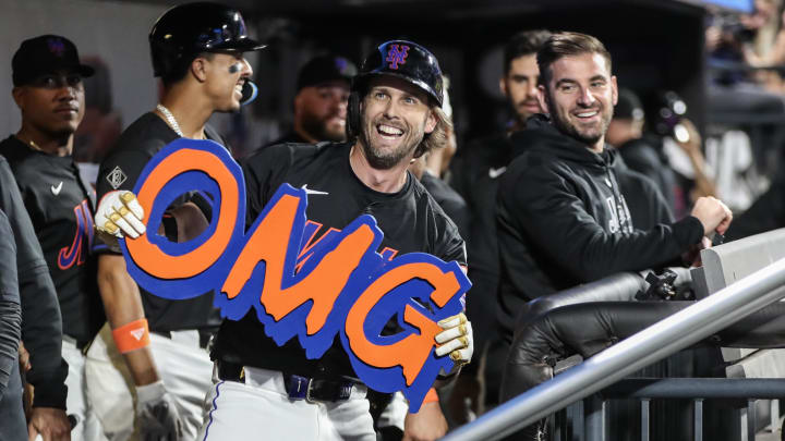 Jun 28, 2024; New York City, New York, USA;  New York Mets second baseman Jeff McNeil (1) celebrates in the dugout after hitting three-run home run in the sixth inning against the Houston Astros at Citi Field.