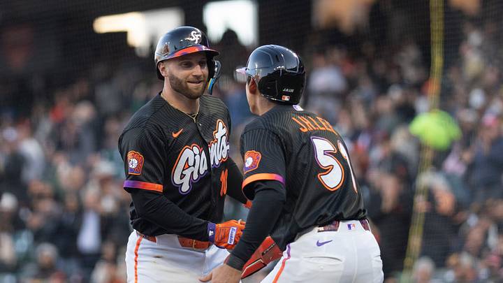 San Francisco, California, USA; San Francisco Giants first baseman Casey Schmitt (10) and San Francisco Giants right fielder Jung Hoo Lee (51) celebrate during the first inning against the San Diego Padres at Oracle Park. Mandatory Credit: Stan Szeto-Imagn Images