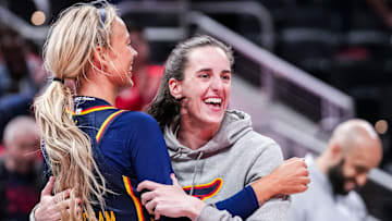 Indiana Fever Sophie Cunningham (8) hugs Indiana Fever Caitlin Clark (22) on Saturday, May 3, 2025, during a preseason game between the Indiana Fever and the Washington Mystics at Gainbridge Fieldhouse in Indianapolis. The Indiana Fever defeated the Washington Mystics in overtime, 79-74.