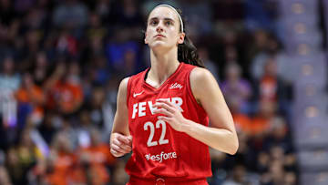 Sep 25, 2024; Uncasville, Connecticut, USA; Indiana Fever guard Caitlin Clark (22) reacts during the first half against the Connecticut Sun during game two of the first round of the 2024 WNBA Playoffs at Mohegan Sun Arena. Mandatory Credit: Paul Rutherford-Imagn Images