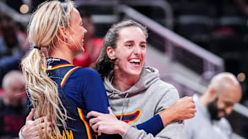 Indiana Fever Sophie Cunningham hugs Caitlin Clark during a preseason game against the Washington Mystics.
