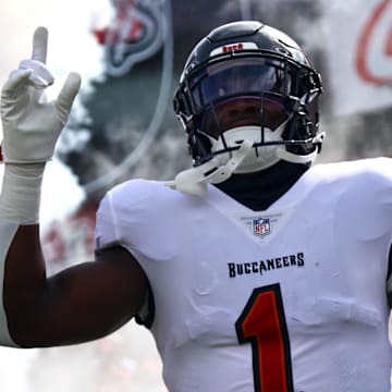 Sep 8, 2024; Tampa, Florida, USA;  Tampa Bay Buccaneers running back Rachaad White (1) runs out of the tunnel as they are introduced before the game Washington Commanders at Raymond James Stadium. Mandatory Credit: Kim Klement Neitzel-Imagn Images