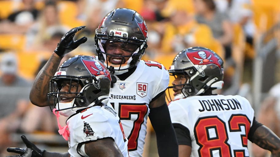 Tampa Bay Buccaneers running back Bucky Irving celebrates his touchdown pass against the Pittsburgh Steelers. | Barry Reeger-Imagn Images