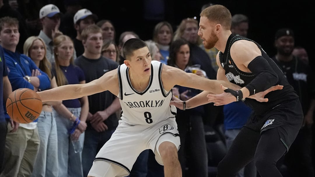 Dec 27, 2025; Minneapolis, Minnesota, USA; Brooklyn Nets guard Egor Demin (8) works around Minnesota Timberwolves guard Donte DiVincenzo (0) in the first quarter at Target Center. Mandatory Credit: Bruce Kluckhohn-Imagn Images