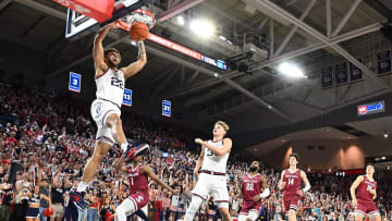 Feb 24, 2024; Spokane, Washington, USA; Gonzaga Bulldogs forward Anton Watson (22) dunks the ball against Santa Clara Broncos guard Tyeree Bryan (1) in the first half at McCarthey Athletic Center. Mandatory Credit: James Snook-USA TODAY Sports