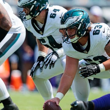 Aug 24, 2024; Philadelphia, Pennsylvania, USA; Philadelphia Eagles center Dylan McMahon (63) prepares to snap the ball against the Minnesota Vikings during the second quarter at Lincoln Financial Field. Mandatory Credit: Caean Couto-Imagn Images