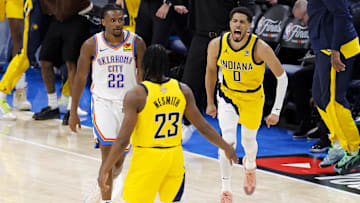 Jun 5, 2025; Oklahoma City, Oklahoma, USA; Indiana Pacers guard Tyrese Haliburton (0) and forward Aaron Nesmith (23) celebrate after Haliburton makes the game winning shot as Oklahoma City Thunder guard Cason Wallace (22) looks on during the fourth quarter during game one of the 2025 NBA Finals at Paycom Center. Mandatory Credit: Alonzo Adams-Imagn Images