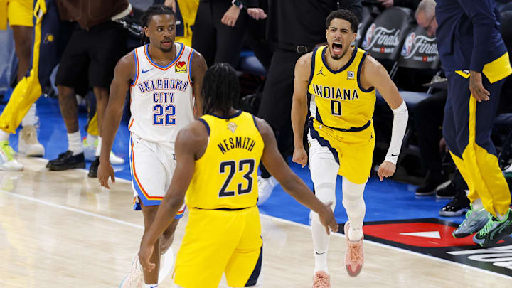 Jun 5, 2025; Oklahoma City, Oklahoma, USA; Indiana Pacers guard Tyrese Haliburton (0) and forward Aaron Nesmith (23) celebrate after Haliburton makes the game winning shot as Oklahoma City Thunder guard Cason Wallace (22) looks on during the fourth quarter during game one of the 2025 NBA Finals at Paycom Center. Mandatory Credit: Alonzo Adams-Imagn Images