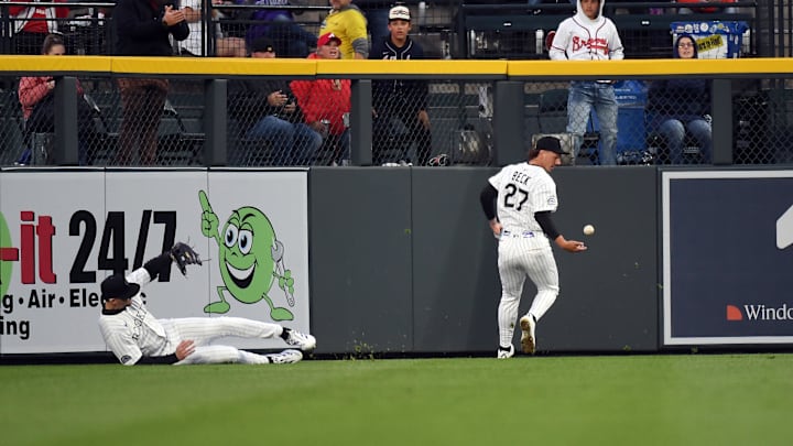 Colorado Rockies outfielders Jordan Beck and Brenton Doyle misplay a ball hit by Atlanta Braves first base Matt Olson.