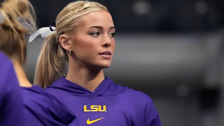 LSU gymnast Livvy Dunne stretches with teammates before Session 2 of the SEC Gymnastics Tournament at Legacy Arena in Birmingham, Alabama. LSU gymnast Livvy Dunne stretches with teammates before Session 2 of the SEC Gymnastics Tournament at Legacy Arena in Birmingham, Alabama.
