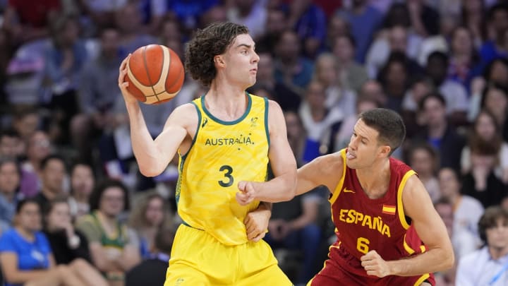 Jul 27, 2024; Villeneuve-d'Ascq, France; Australia guard Josh Giddey (3) is defended by Spain forward Xabi Lopez-Arostegui (6) in men's Group A play during the Paris 2024 Olympic Summer Games at Stade Pierre-Mauroy. Mandatory Credit: John David Mercer-USA TODAY Sports