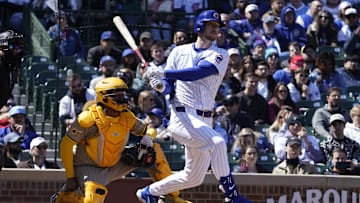 Apr 6, 2025; Chicago, Illinois, USA; Chicago Cubs outfielder Kyle Tucker (30) hits a one-run single against the San Diego Padres during the first inning at Wrigley Field. 