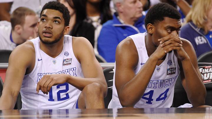 Apr 4, 2015; Indianapolis, IN, USA; Kentucky Wildcats forward Karl-Anthony Towns (12) and Dakari Johnson (44) sit on the bench following their loss to the Wisconsin Badgers 71-64 in the 2015 NCAA Men's Division I Championship semi-final game at Lucas Oil Stadium. Mandatory Credit: Robert Deutsch-USA TODAY Sports