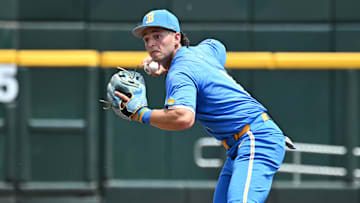 Jun 14, 2025; Omaha, Neb, USA;  UCLA Bruins shortstop Roch Cholowsky (1) completes a double play against the Murray State Racers during the second inning at Charles Schwab Field. Mandatory Credit: Steven Branscombe-Imagn Images