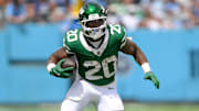 Sep 15, 2024; Nashville, Tennessee, USA;  New York Jets running back Breece Hall (20) runs the ball against the Tennessee Titans during the first half at Nissan Stadium. Mandatory Credit: Steve Roberts-Imagn Images