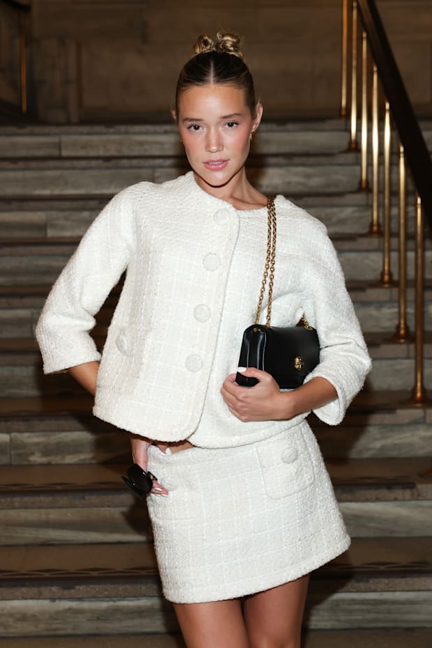 Olivia Ponton at the Marc Jacobs 2025 Runway Show at the New York Public Library in a white mini dress.
