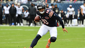 Oct 19, 2025; Chicago, Illinois, USA; Chicago Bears quarterback Caleb Williams (18) rushes the ball against the New Orleans Saints during the first quarter at Soldier Field. Mandatory Credit: Mike Dinovo-Imagn Images