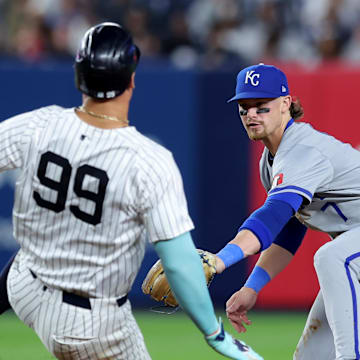 Sep 9, 2024; Bronx, New York, USA; Kansas City Royals shortstop Bobby Witt Jr. (7) tags out New York Yankees designated hitter Aaron Judge (99) at second base to complete a double play on a ball hit by Yankees catcher Austin Wells (not pictured) during the fifth inning at Yankee Stadium. Mandatory Credit: Brad Penner-Imagn Images