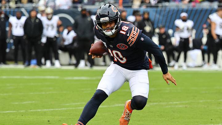 Oct 19, 2025; Chicago, Illinois, USA; Chicago Bears quarterback Caleb Williams (18) rushes the ball against the New Orleans Saints during the first quarter at Soldier Field. Mandatory Credit: Mike Dinovo-Imagn Images