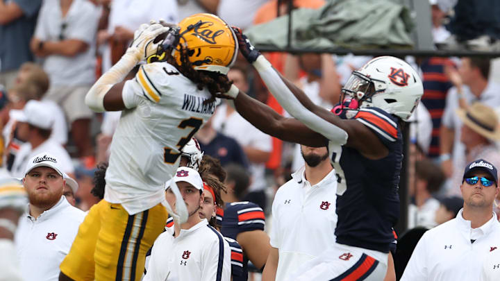 Cal cornerback Nohl Williams  intercepts a pass late in Saturday's game