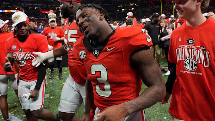 Georgia running back Nate Frazier (3) celebrates after the winning the SEC championship game against Texas in Atlanta, on Saturday, Dec. 7, 2024. Georgia won 22-19. Georgia running back Nate Frazier (3) celebrates after the winning the SEC championship game against Texas in Atlanta, on Saturday, Dec. 7, 2024. Georgia won 22-19.