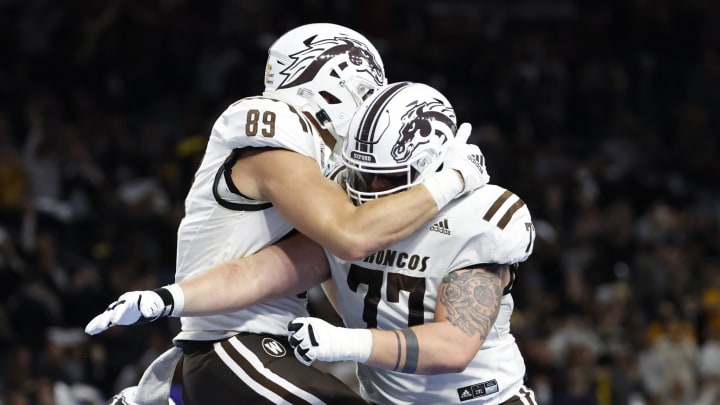 Dec 27, 2021; Detroit, MI, USA; Western Michigan Broncos tight end Brett Borske (89) celebrates with offensive lineman Jacob Gideon (77) after scoring a touchdown in the first half against the Nevada Wolf Pack during the 2021 Quick Lane Bowl at Ford Field. Mandatory Credit: Rick Osentoski-USA TODAY Sports