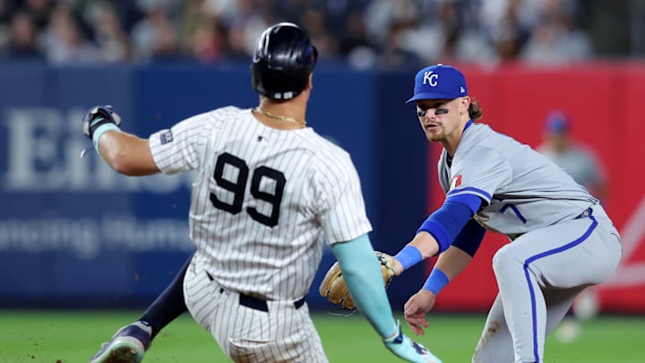 Sep 9, 2024; Bronx, New York, USA; Kansas City Royals shortstop Bobby Witt Jr. (7) tags out New York Yankees designated hitter Aaron Judge (99) at second base to complete a double play on a ball hit by Yankees catcher Austin Wells (not pictured) during the fifth inning at Yankee Stadium. Mandatory Credit: Brad Penner-Imagn Images