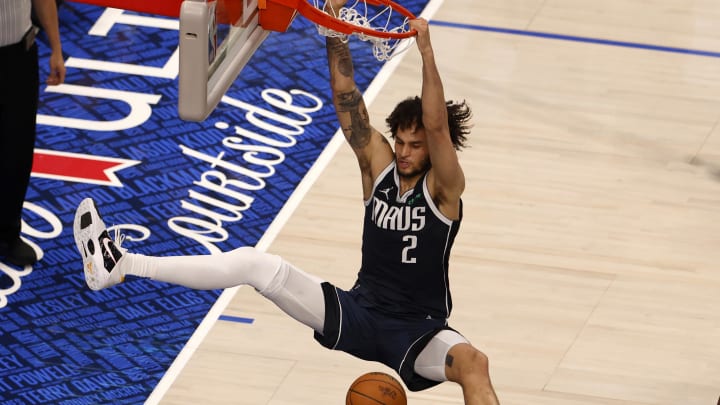 Jun 12, 2024; Dallas, Texas, USA; Dallas Mavericks center Dereck Lively II (2) dunks against Boston Celtics guard Jaylen Brown (7) during the third quarter in game three of the 2024 NBA Finals at American Airlines Center. Mandatory Credit: Peter Casey-USA TODAY Sports