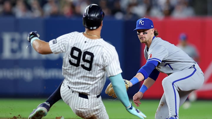 Sep 9, 2024; Bronx, New York, USA; Kansas City Royals shortstop Bobby Witt Jr. (7) tags out New York Yankees designated hitter Aaron Judge (99) at second base to complete a double play on a ball hit by Yankees catcher Austin Wells (not pictured) during the fifth inning at Yankee Stadium. Mandatory Credit: Brad Penner-Imagn Images