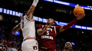 South Carolina Gamecocks guard Meechie Johnson (5) attempts a basket while being guarded by Auburn Tigers forward Johni Broome (4) during their quarterfinal game of the SEC Men's Basketball Tournament at Bridgestone Arena in Nashville, Tenn., Friday, March 15, 2024.