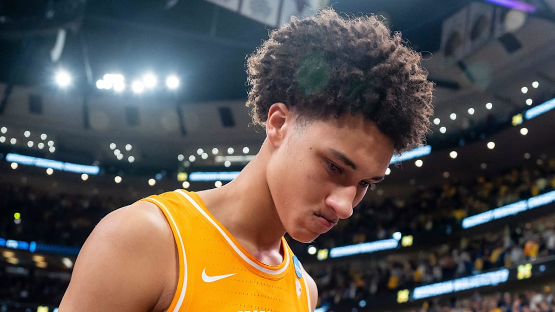 Tennessee forward Nate Ament (10) walks off the court as Michigan players celebrate their Final Four berth behind him after a NCAA Tournament Elite 8 game between Tennessee and Michigan at the United Center in Chicago on March 29, 2026.