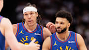Apr 20, 2024; Denver, Colorado, USA; Denver Nuggets guard Jamal Murray (27) and forward Aaron Gordon (50) react during the fourth quarter against the Los Angeles Lakers in game one of the first round for the 2024 NBA playoffs at Ball Arena. Mandatory Credit: Andrew Wevers-Imagn Images