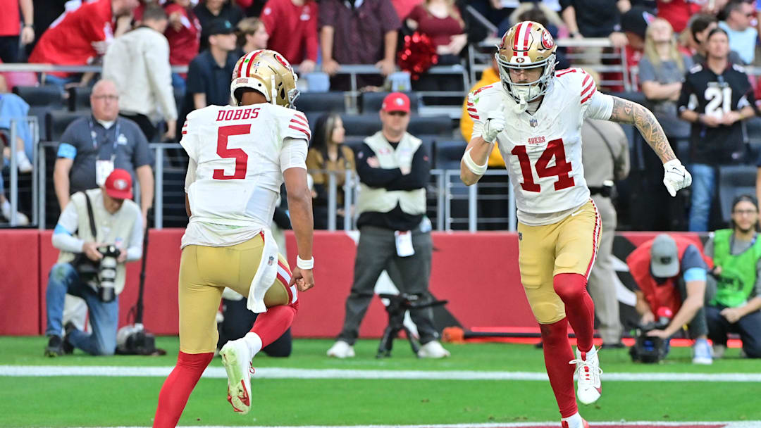 Jan 5, 2025; Glendale, Arizona, USA; San Francisco 49ers wide receiver Ricky Pearsall (14) and quarterback Joshua Dobbs (5) celebrate after connecting for a touchdown in the first half against the Arizona Cardinals at State Farm Stadium. Mandatory Credit: Matt Kartozian-Imagn Images
