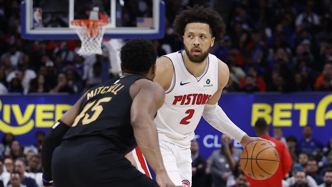 May 5, 2026; Detroit, Michigan, USA; Detroit Pistons guard Cade Cunningham (2) dribbles defended by Cleveland Cavaliers guard Donovan Mitchell (45) in the second half during game one of the second round of the 2026 NBA Playoffs at Little Caesars Arena. Mandatory Credit: Rick Osentoski-Imagn Images