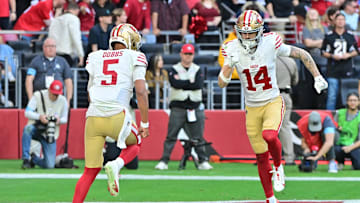 Jan 5, 2025; Glendale, Arizona, USA; San Francisco 49ers wide receiver Ricky Pearsall (14) and quarterback Joshua Dobbs (5) celebrate after connecting for a touchdown in the first half against the Arizona Cardinals at State Farm Stadium. Mandatory Credit: Matt Kartozian-Imagn Images