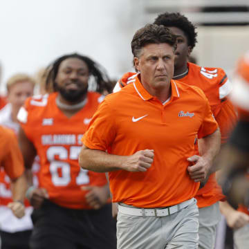 Sep 16, 2023; Stillwater, Oklahoma, USA; Oklahoma State coach Mike Gundy takes the field before an NCAA football game between Oklahoma State and South Alabama at Boone Pickens Stadium. South Alabama won 33-7. Mandatory Credit: Bryan Terry-USA TODAY Sports