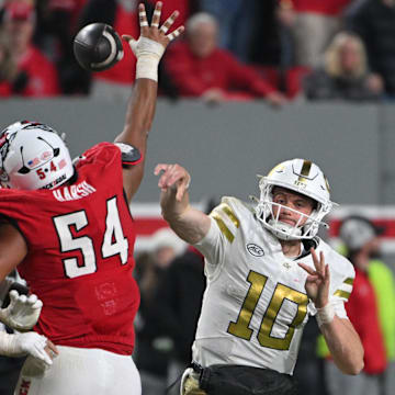 Nov 1, 2025; Raleigh, North Carolina, USA;  Georgia Tech Yellow Jackets quarterback Haynes King (10) throws a pass during the fourth quarter against the NC State Wolfpack at Carter-Finley Stadium. Mandatory Credit: Zachary Taft-Imagn Images