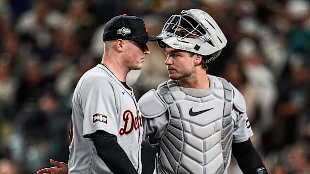 Tigers pitcher Tarik Skubal talks to catcher Dillion Dingler after throwing the fourth inning against Mariners at ALDS Game 5