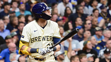 Aug 12, 2025; Milwaukee, Wisconsin, USA; Milwaukee Brewers designated hitter Christian Yelich (22) hits a 2-run home run in the fifth inning against the Pittsburgh Pirates at American Family Field. Mandatory Credit: Benny Sieu-Imagn Images