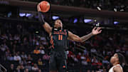 Dec 10, 2024; New York, New York, USA;  Miami Hurricanes guard A.J. Staton-McCray (11) grabs a rebound in the second half against the Tennessee Volunteers at Madison Square Garden. Mandatory Credit: Wendell Cruz-Imagn Images