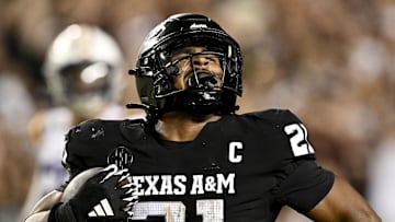 Oct 26, 2024; College Station, Texas, USA; Texas A&M Aggies linebacker Taurean York (21) reacts after catching the ball for an interception in the fourth quarter against the LSU Tigers at Kyle Field. Mandatory Credit: Maria Lysaker-Imagn Images. 