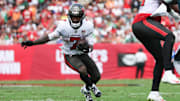 Sep 28, 2025; Tampa, Florida, USA; Tampa Bay Buccaneers running back Bucky Irving (7) runs the ball during the first quarter against the Philadelphia Eagles at Raymond James Stadium. 