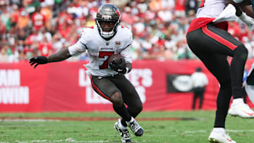 Sep 28, 2025; Tampa, Florida, USA; Tampa Bay Buccaneers running back Bucky Irving (7) runs the ball during the first quarter against the Philadelphia Eagles  at Raymond James Stadium. 
