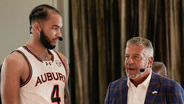 Auburn head coach Bruce Pearl talks to player Johni Broome during SEC Media Day at the Grand Bohemian Hotel in Mountain Brook Tuesday, Oct. 15, 2024.