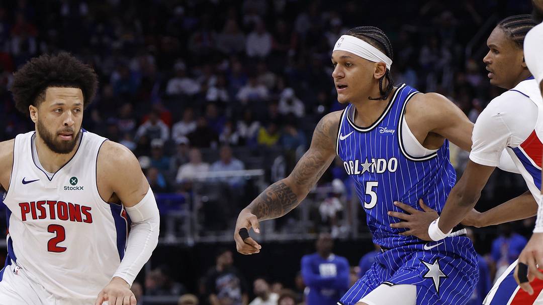 May 3, 2026; Detroit, Michigan, USA; Detroit Pistons guard Cade Cunningham (2) dribbles defended by Orlando Magic forward Paolo Banchero (5) in the second half during game seven of the first round of the 2026 NBA Playoffs at Little Caesars Arena. Mandatory Credit: Rick Osentoski-Imagn Images
