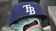 Sep 26, 2025; Toronto, Ontario, CAN; The hat and glove of Tampa Bay Rays third baseman Junior Caminero (13) in the dugout during the game against the Toronto Blue Jays at Rogers Centre. 