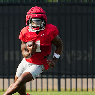 Aug 8, 2024; Columbus, Ohio, USA; Ohio State Buckeyes running back Quinshon Judkins (1) carries the ball during football practice at the Woody Hayes Athletic Complex.