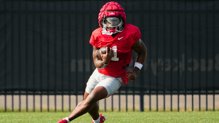 Aug 8, 2024; Columbus, Ohio, USA; Ohio State Buckeyes running back Quinshon Judkins (1) carries the ball during football practice at the Woody Hayes Athletic Complex.