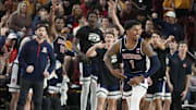 Arizona Wildcats guard Caleb Love (1) reacts after sinking a 3-point shot during a Big 12 men's basketball game against the Arizona State Sun Devils at Desert Financial Arena.